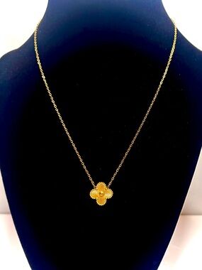 Gold Plated over stainless steel. Waterproof and tarnish resistant.